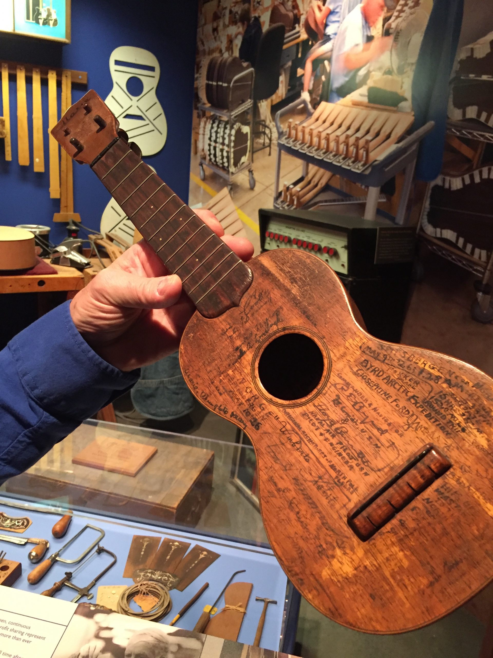 8 martin uke Martin ukulele covered in the signatures of famous people.