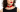 Model wearing red choker.