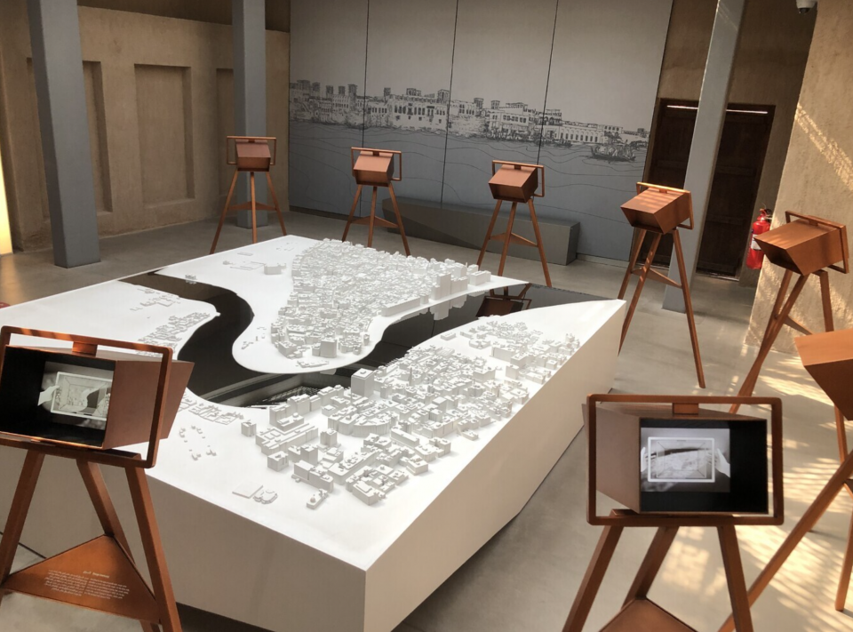 al shindagha Room with topographical map and easels with focus lens on specific parts of the maps.