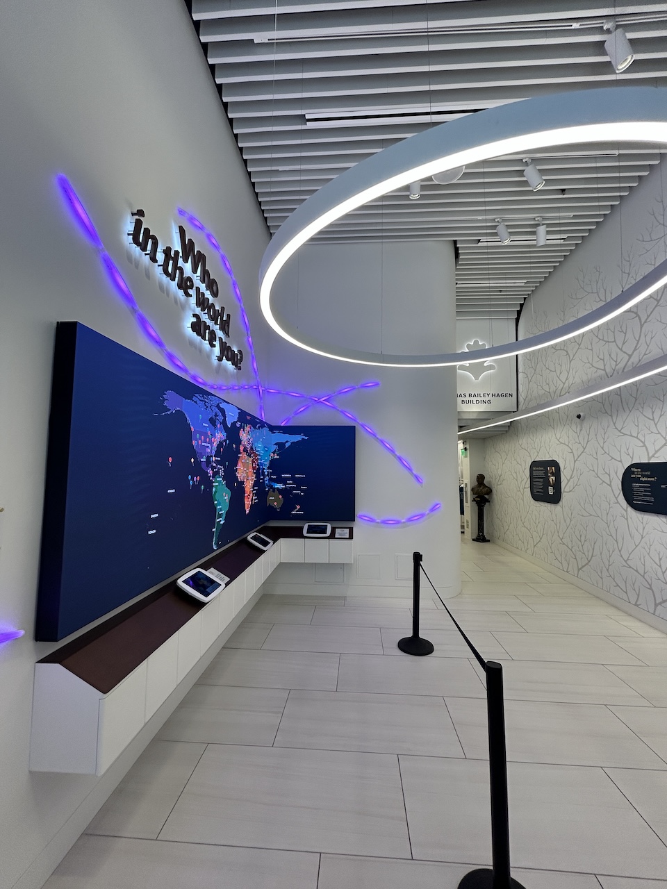 97 newbury after New space with modern white decor, neon lights and a large LED interactive screen.
