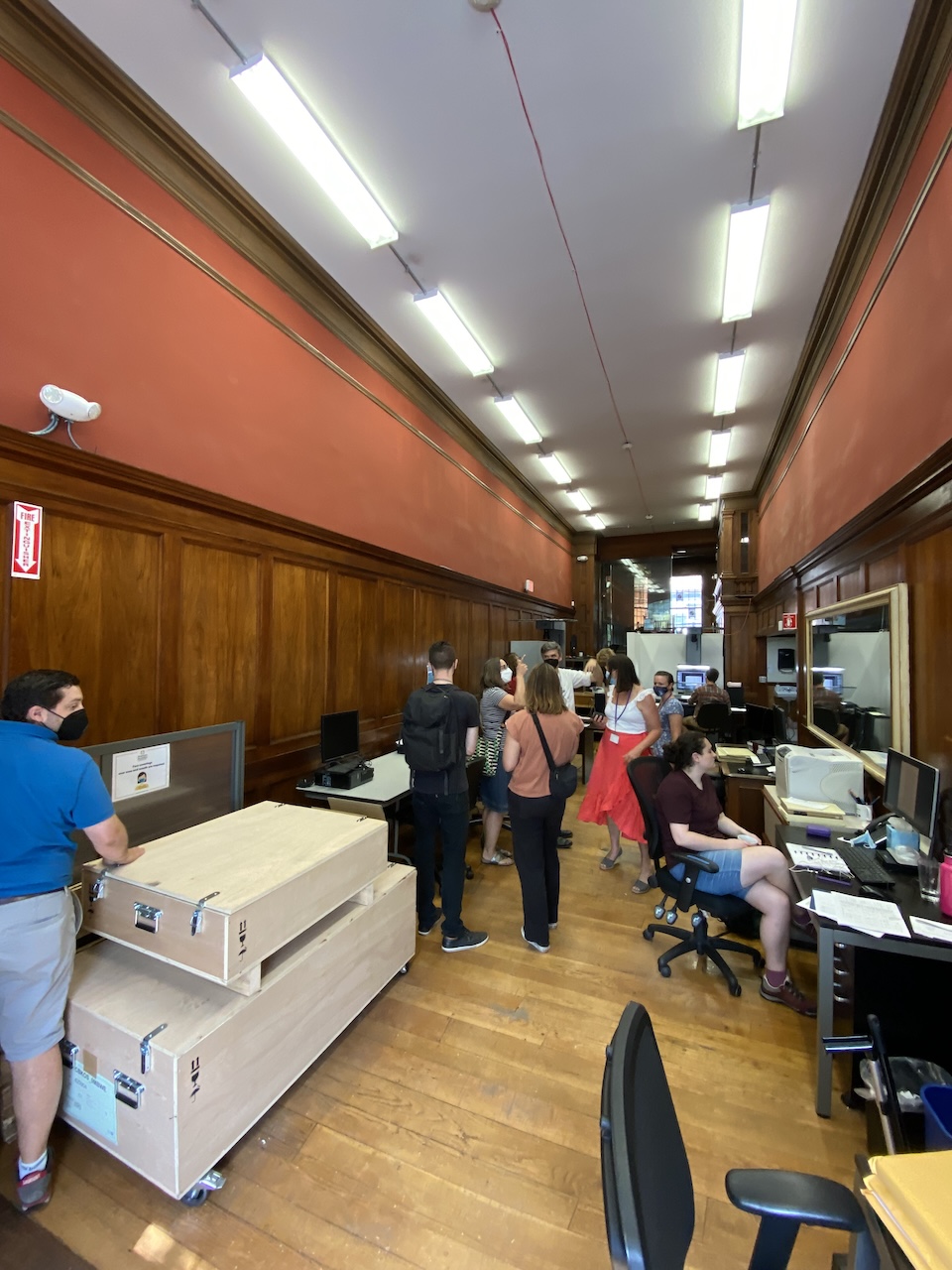 97 newbury before View of an old wood paneled office retail space.